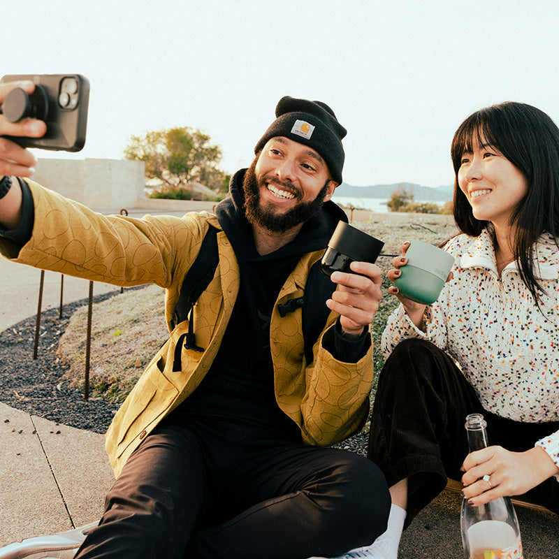 bring-your-own-party-kit-tumblers-and-cocktails-k1 8oz_rise_lowball_black_iceberg_couple_selfie_city_square.jpg